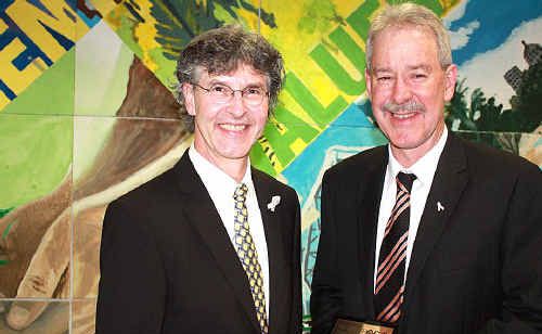 Heritage Building Society CEO John Minz (right) receives his CEO Challenge Race award from White Ribbon Day co-founder Dr Michael Kaufman. Heritage Building Society CEO John Minz (right) receives his CEO Challenge Race award from White Ribbon Day co-founder Dr Michael Kaufman.